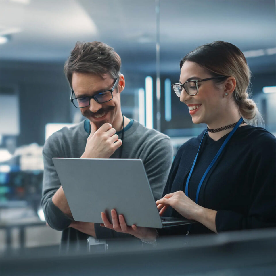 Two engineers using laptop
